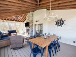 Spacious screened-in porch offers bug-free outdoor dining plus lounging